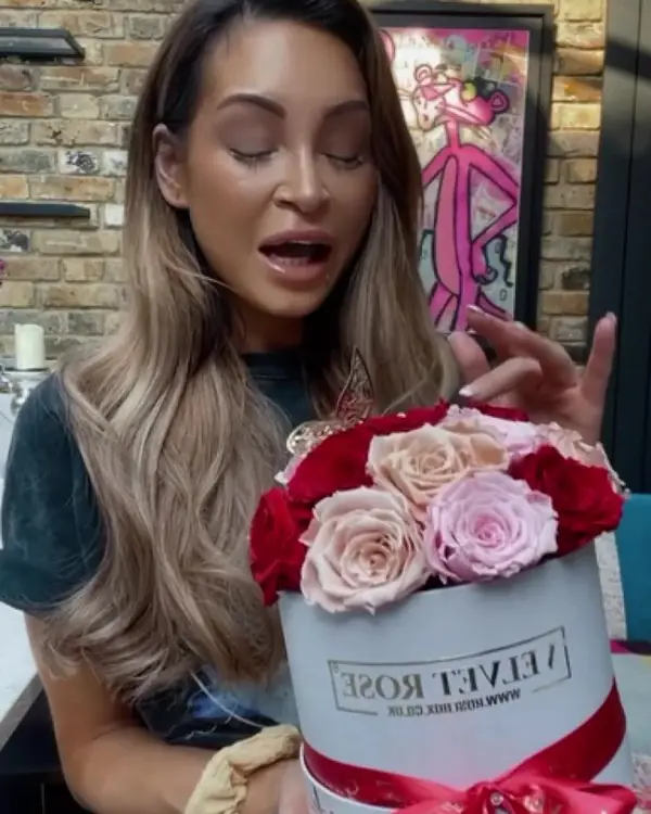 AJ Bunker opening a Velvet Rose box of red and blush roses