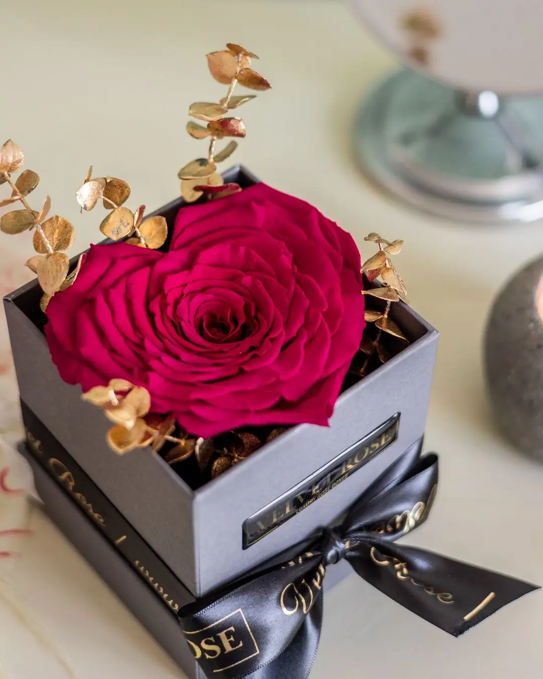 The Single Rose with a black satin ribbon